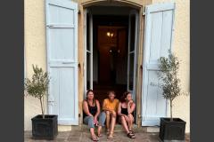 Good friends pause one evening at the chateau entrance